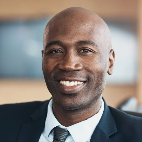 mature man in a business suit smiling