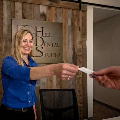 receptionist handing out card